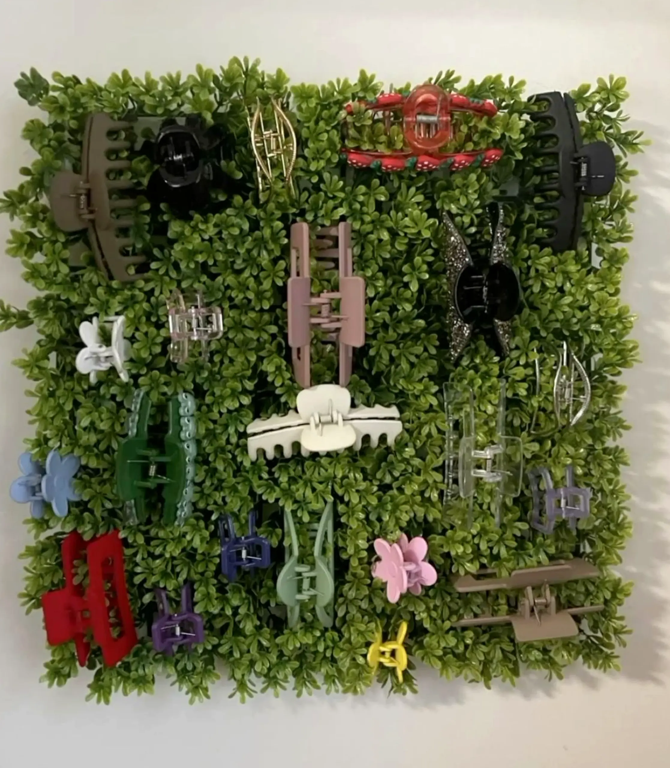 Leafy wood shelving brings a useful note of rhythm, making the garden edge feel easy to enjoy.