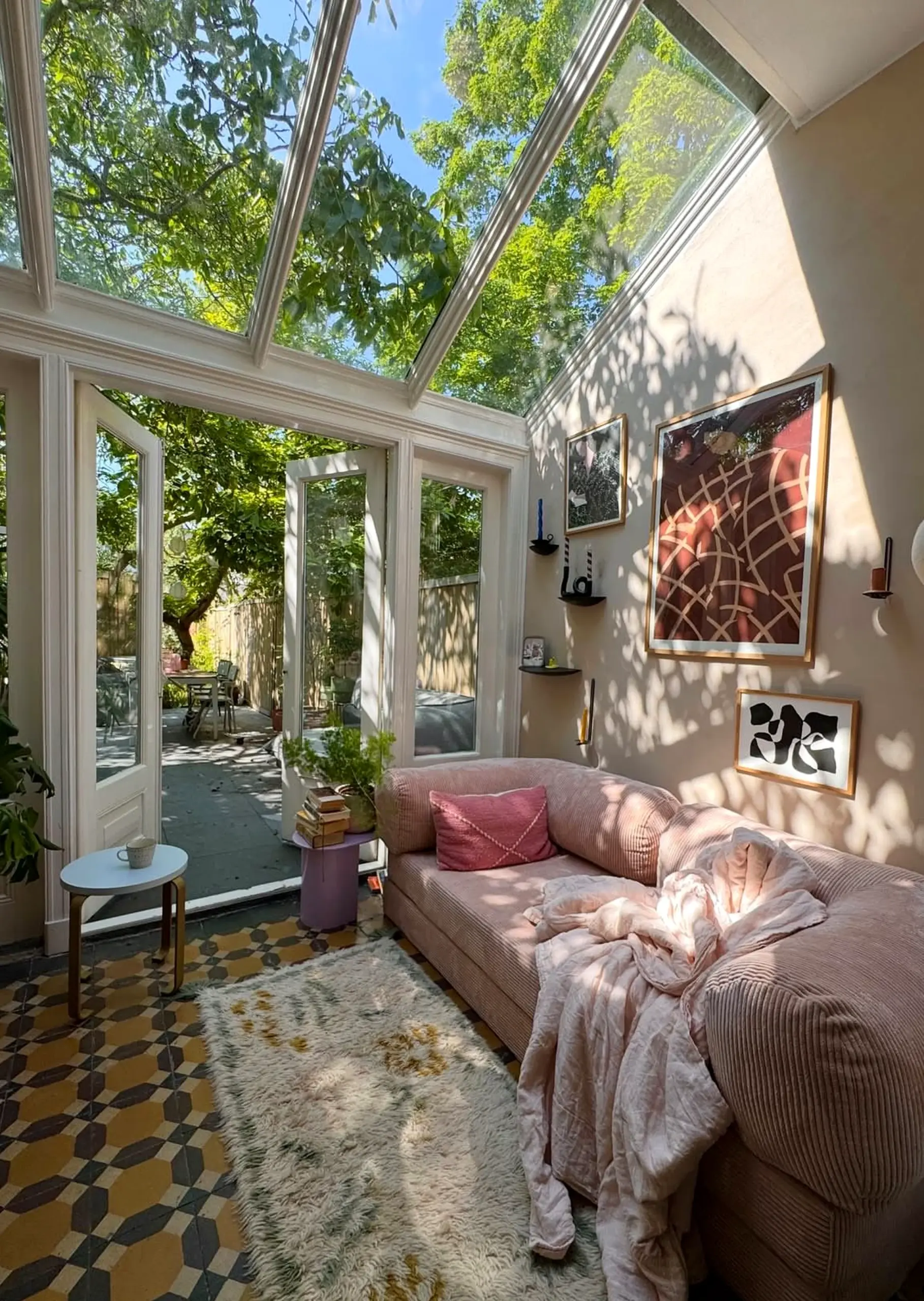 Earthy vase display frames the outdoor space with shape, making the scene feel fresh and intentional.