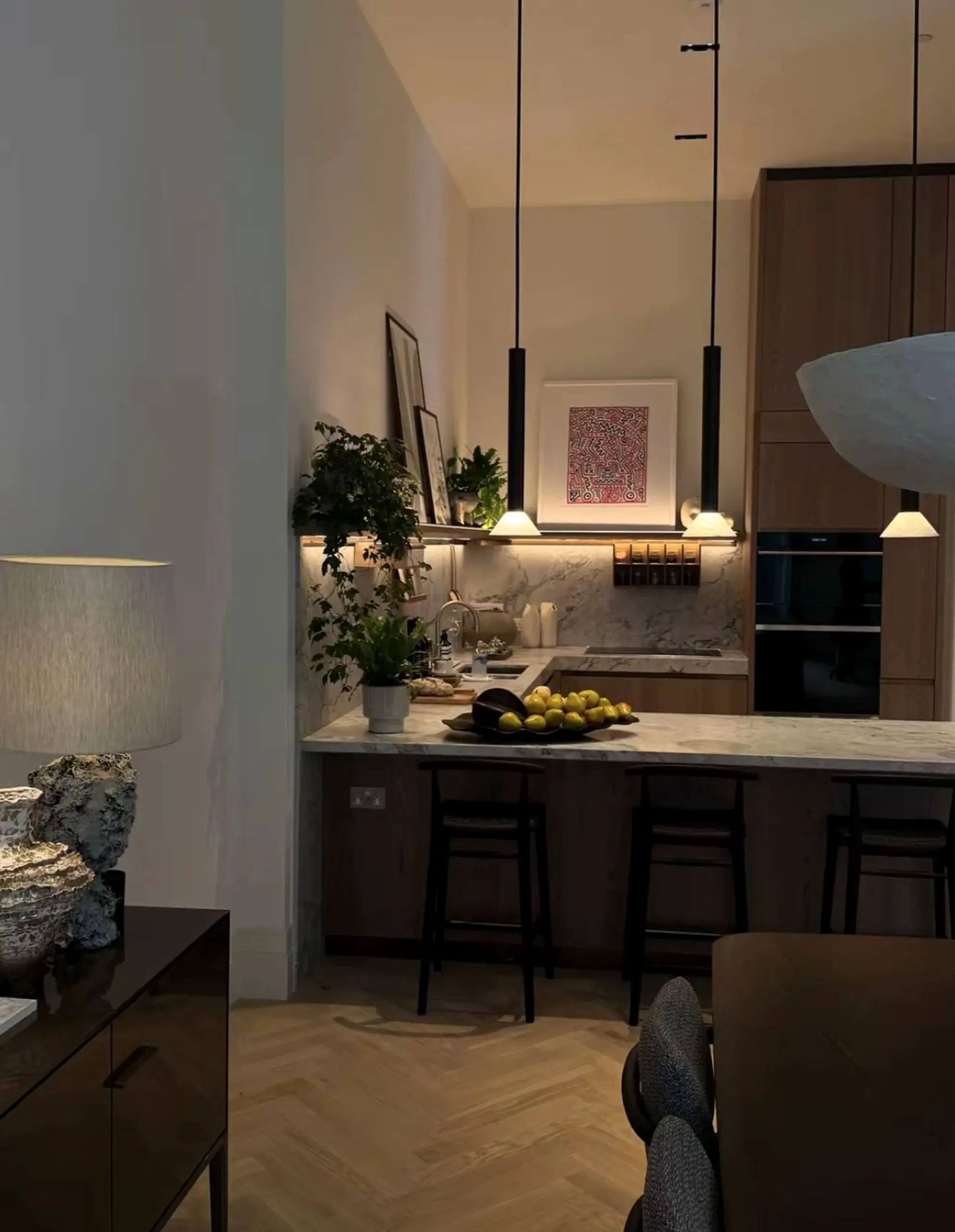 Subtle ceiling detail brings a useful note of focus, making the corner feel fresh and intentional.