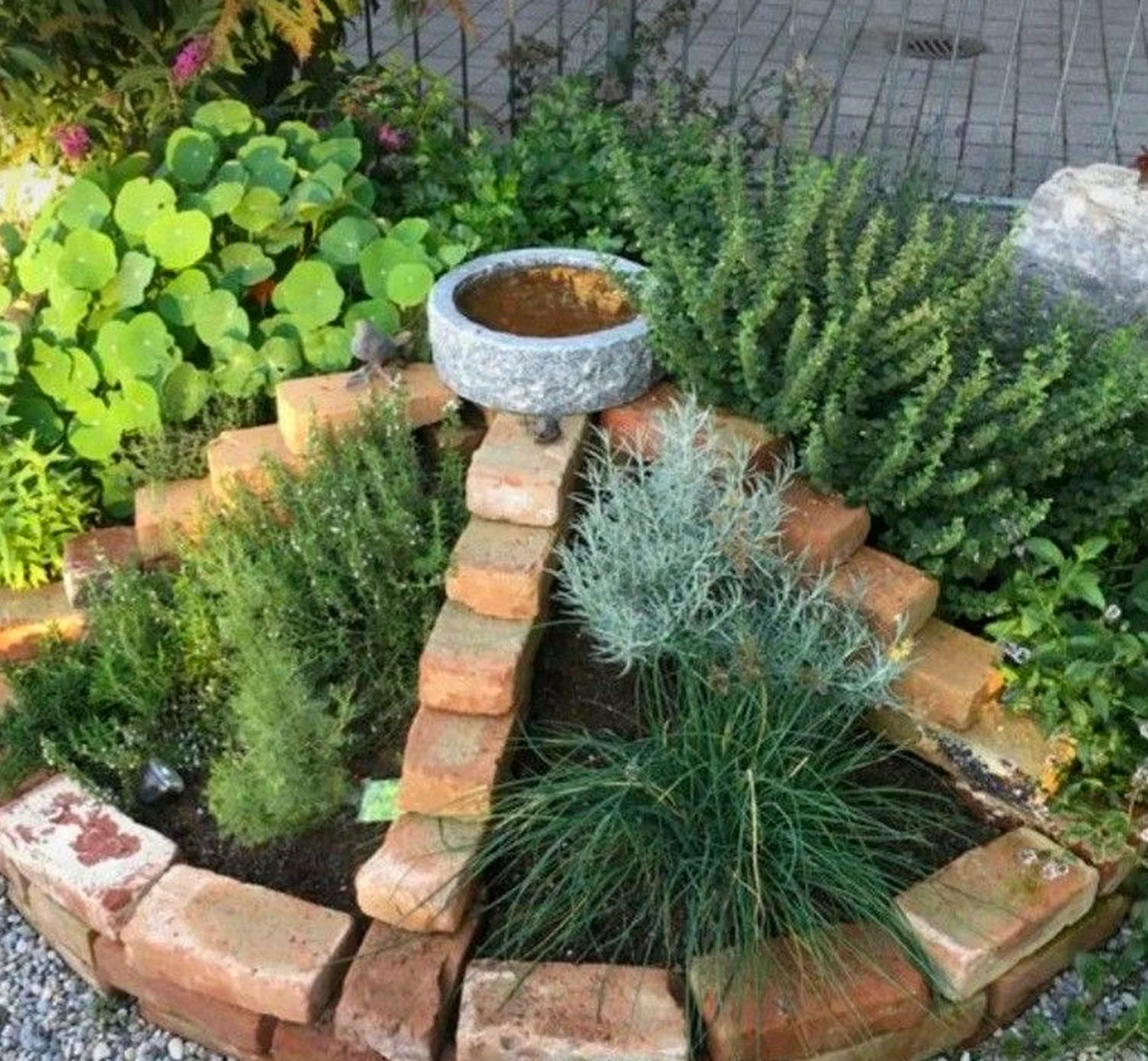 Textured stone terrace adds character across the garden edge, giving the decor a finish that feels settled and welcoming.