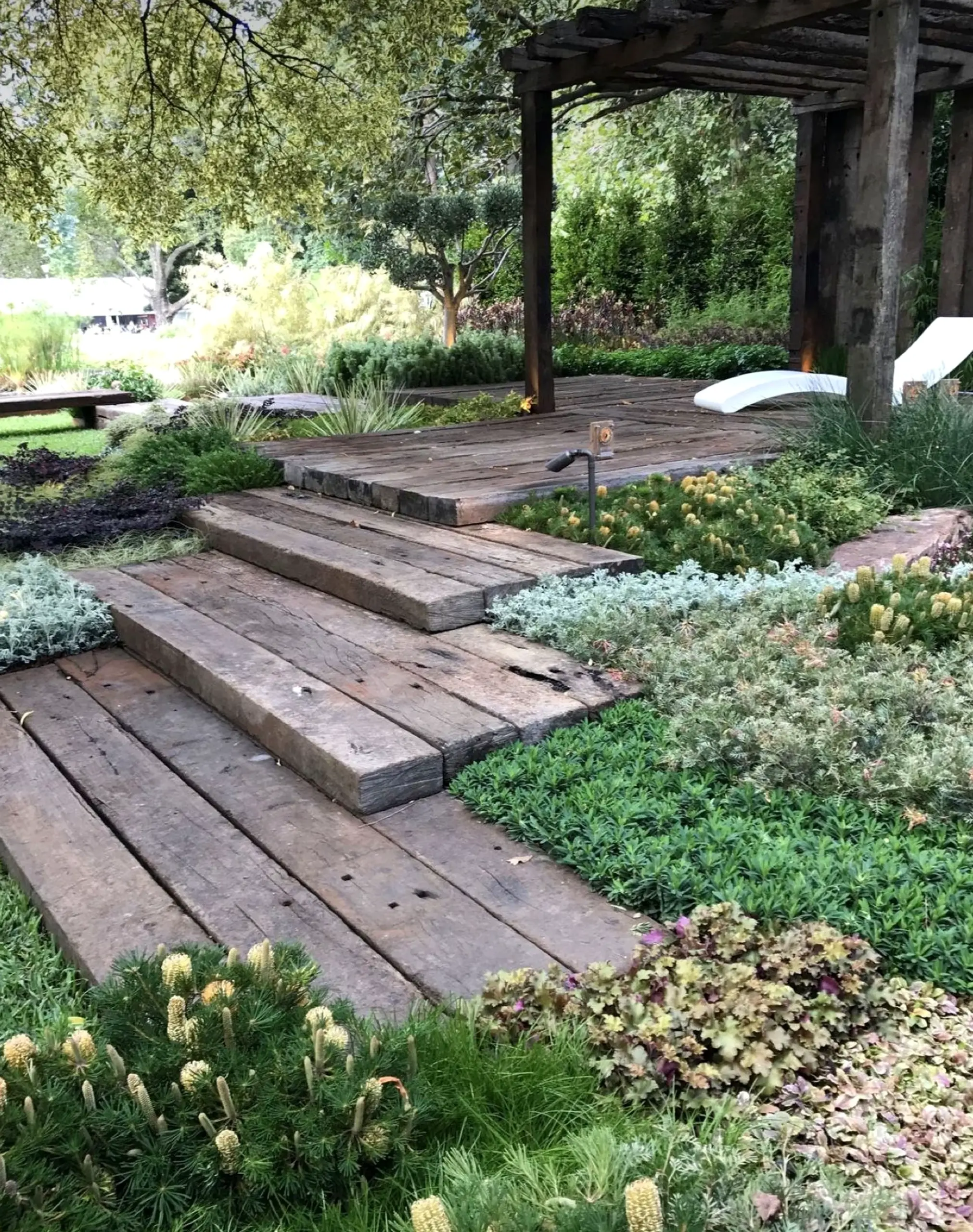 Calm stone terrace frames the design with freshness, making the scene feel fresh and intentional.