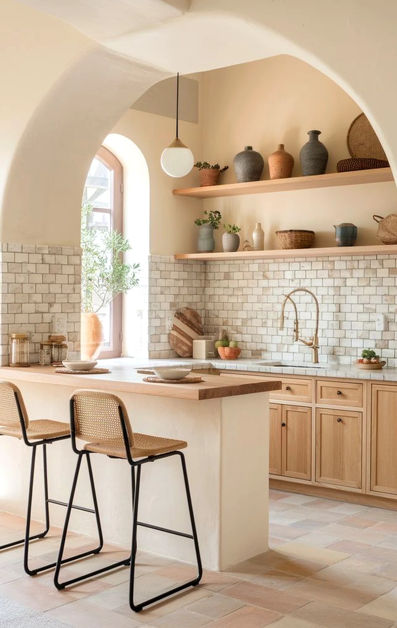 Bright arched doorway supports the outdoor space through warmth, leaving the space feeling pleasantly composed.