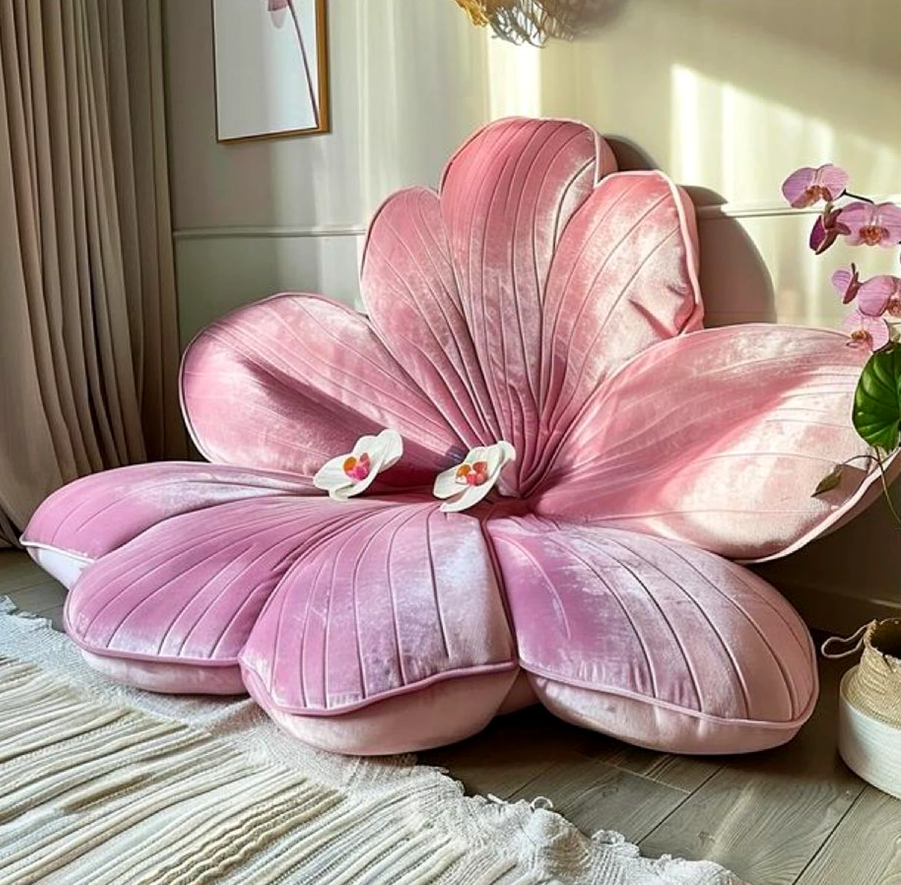 Compact flower arrangement gives the corner more depth, so the whole view feels pleasantly composed.