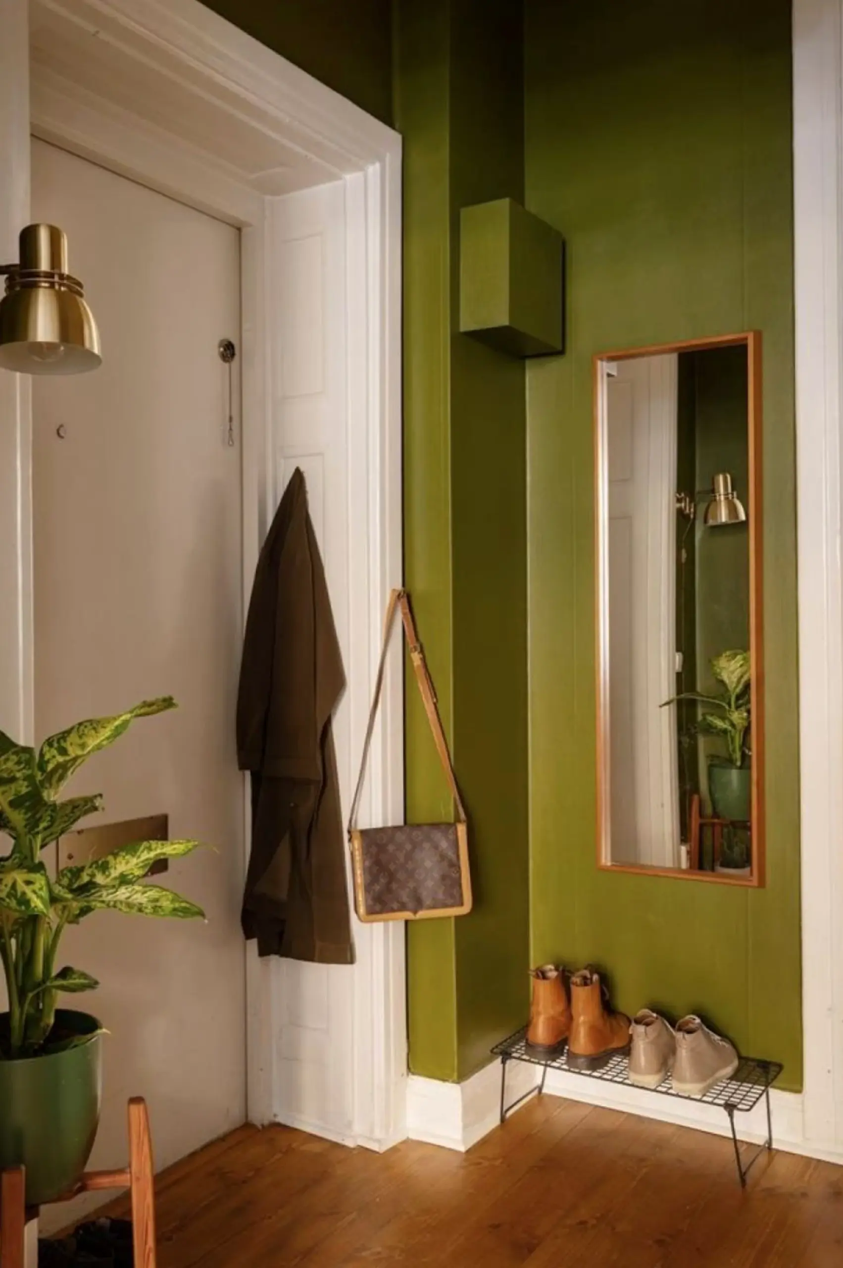 Leafy greenhouse corner brings order to the setting, creating a mood that feels warm without clutter.