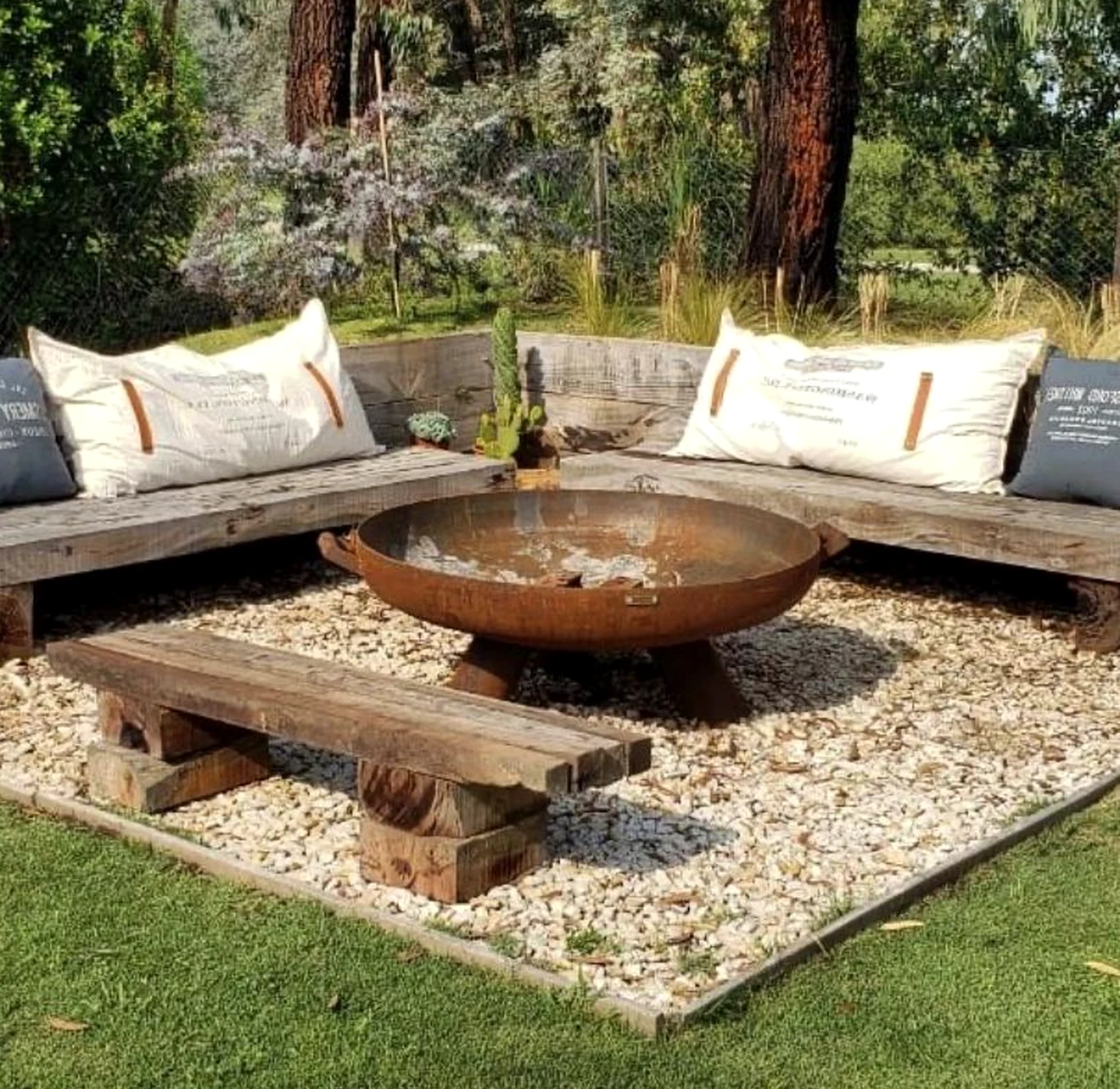 Earthy greenhouse corner frames the garden edge with comfort, making the scene feel easy to enjoy.